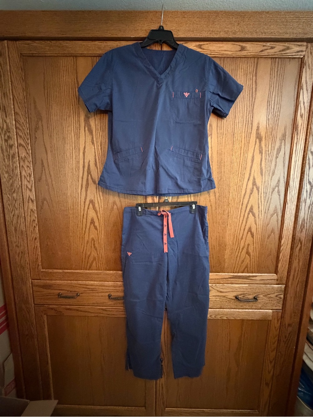 Med Couture Navy Scrub Top & Jogger Set with Coral Drawstring